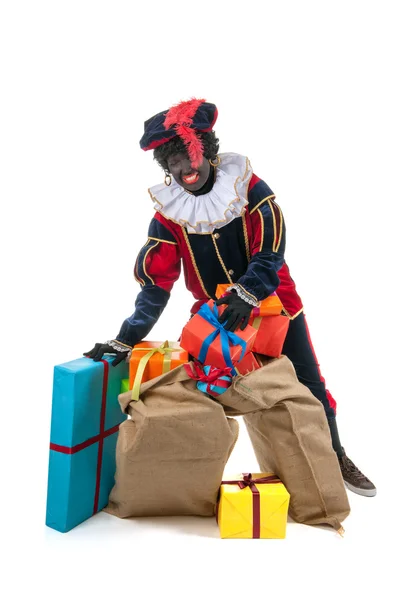 Dutch black pete with many presents — Stock Photo, Image