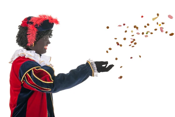 Dutch black pete throwing Sinterklaas candy — Stock Photo, Image