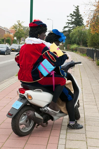 Black Petes on scooter — Stock Photo, Image