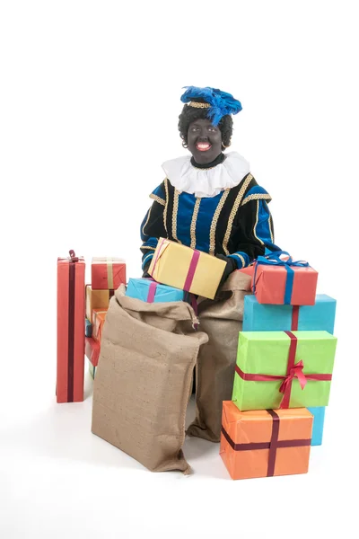 Dutch black pete with many presents — Stock Photo, Image