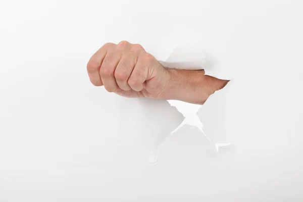 Fist through the wall — Stock Photo, Image
