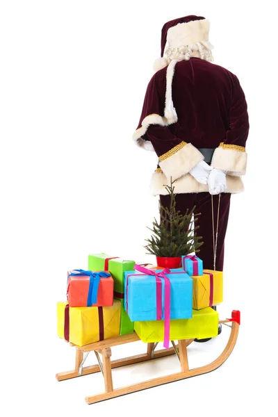 Santa Claus y trineo con muchos regalos de Navidad — Foto de Stock