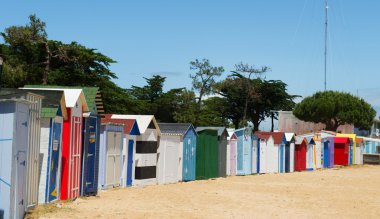 Beach huts on island Oleron in France clipart