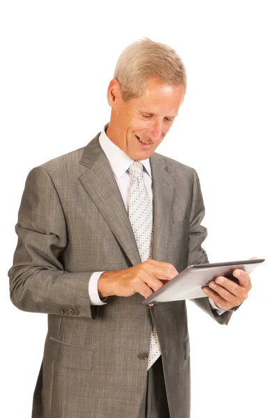 Homem de negócios sênior com tablet — Fotografia de Stock