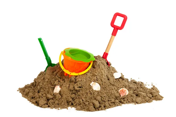 Heap sand with plastic toys at the beach — Stock Photo, Image