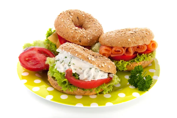 Fresh bagels with cheese and fish — Stock Photo, Image