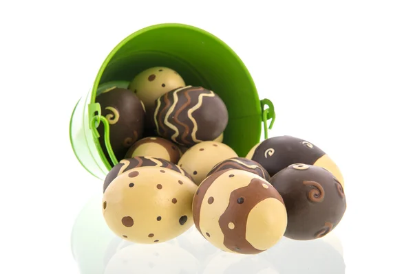 Chocolate eggs in green bucket — Stock Photo, Image