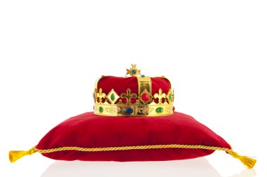 Golden crown on velvet pillow clipart