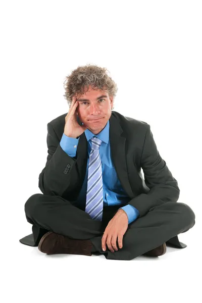 Critical manager sitting on floor — Stock Photo, Image