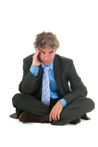 Critical manager sitting on floor — Stock Photo, Image