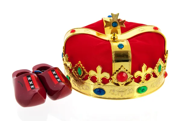 Dutch golden crown for the king and wooden clogs — Stock Photo, Image