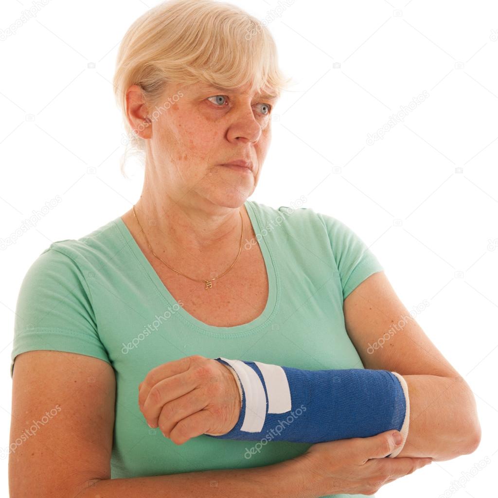 Old woman with broken wrist in gypsum
