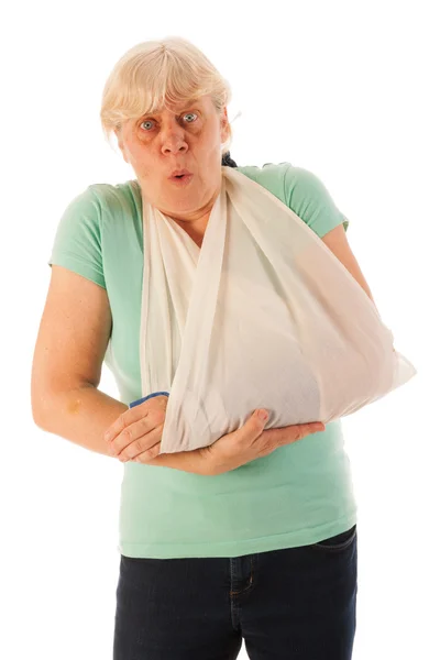 Old woman with broken wrist in gypsum — Stock Photo, Image