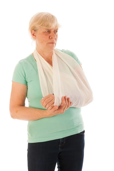 Old woman with broken wrist in gypsum — Stock Photo, Image