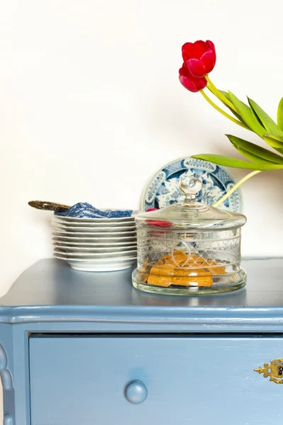 Lavender colored cabinet with antique — Stock Photo, Image