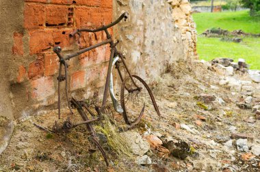 Rusty bicycle in Oradour sur Glane clipart