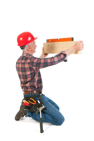 Manual worker with water rule — Stock Photo, Image