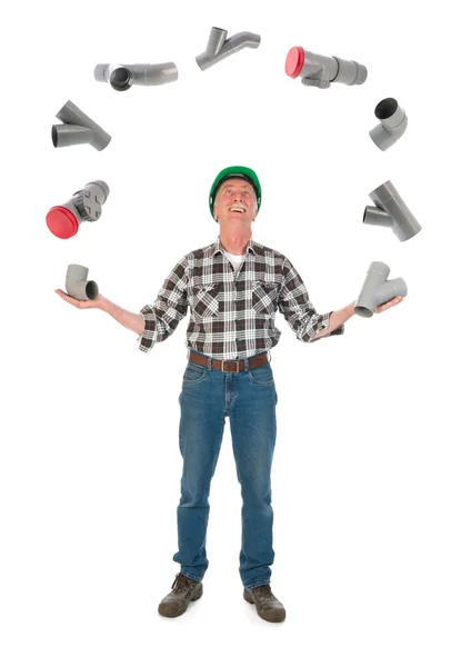 Juggling plumber with PVC tubes — Stock Photo, Image