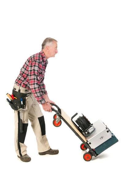 Manual worker with heavy toolkit — Stock Photo, Image