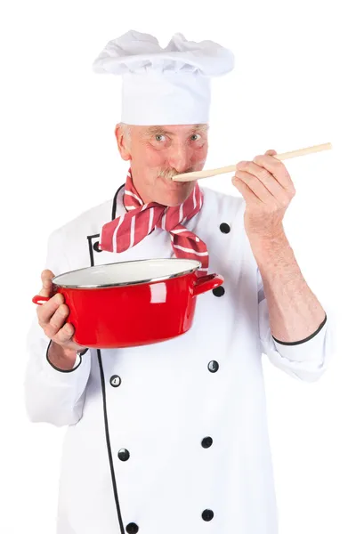 Cozinhe saborear a comida — Fotografia de Stock