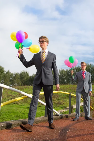 Hombres de negocios con globos —  Fotos de Stock