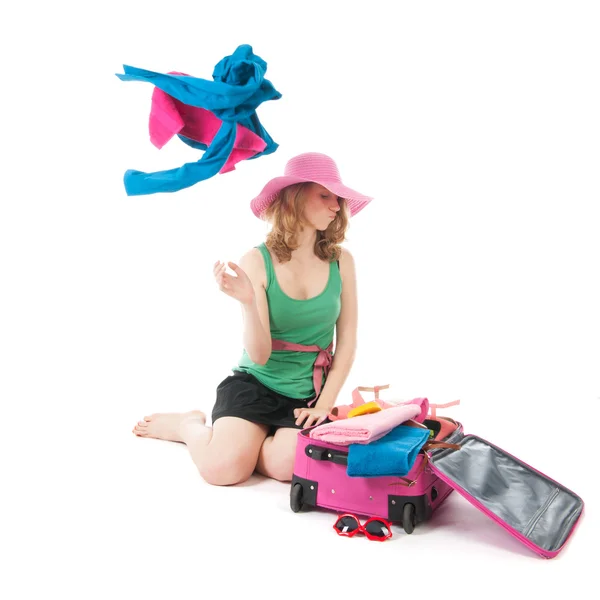 Packing the suitcase by a young woman — Stock Photo, Image