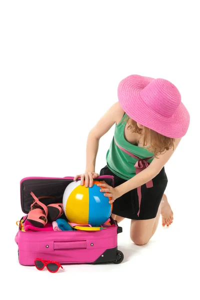 Packing the suitcase by a young woman — Stock Photo, Image