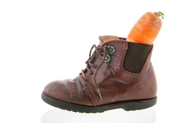 Leather shoe with carrot — Stock Photo, Image