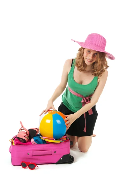 Packing the suitcase by a young woman — Stock Photo, Image