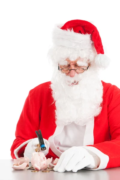 Santa łamanie jego skarbonka — Zdjęcie stockowe