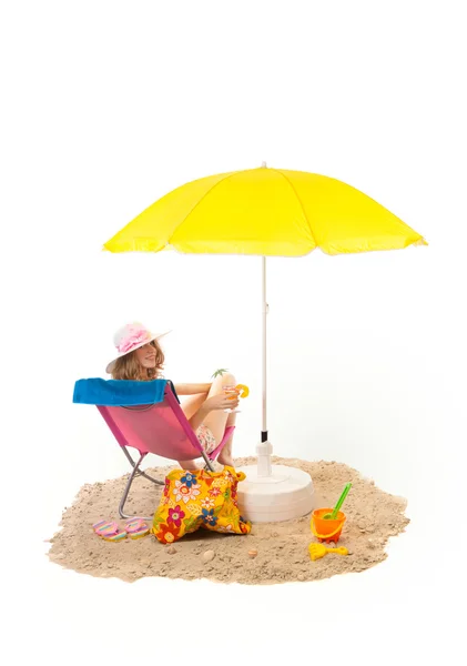 Tranquil beach with woman in chair — Stock Photo, Image