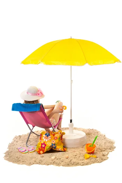 Tranquil beach with woman in chair — Stock Photo, Image