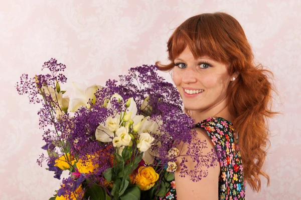 Woman with colorful flowers — Stock Photo, Image