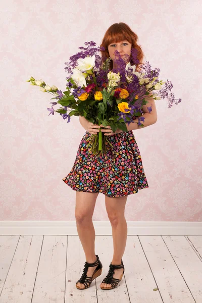 Woman with colorful flowers — Stock Photo, Image