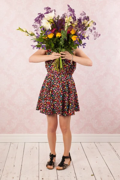Woman with colorful flowers — Stock Photo, Image