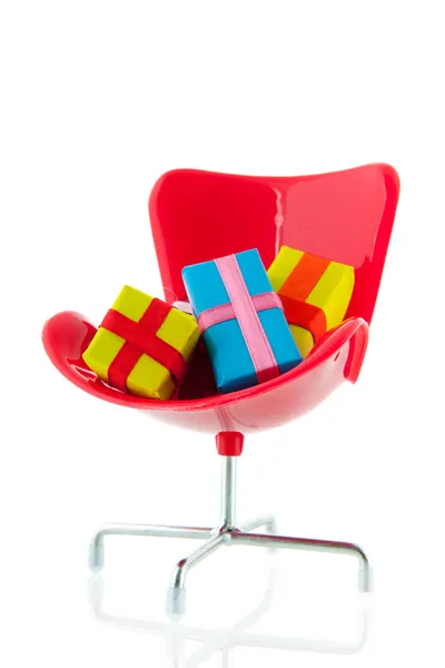 Kancelářská židle s dárky — Stock fotografie