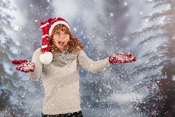 Winter woman with hat of Christmas Santa in snow Stock Photo