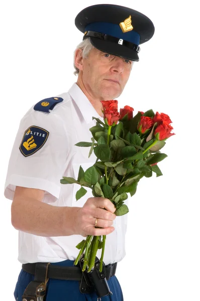 Police man with roses — Stock Photo, Image