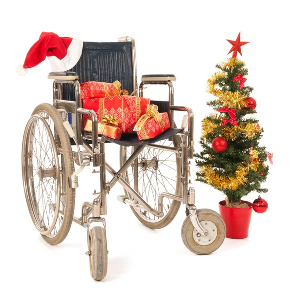 Empty wheelchair for Christmas party — Stock Photo, Image