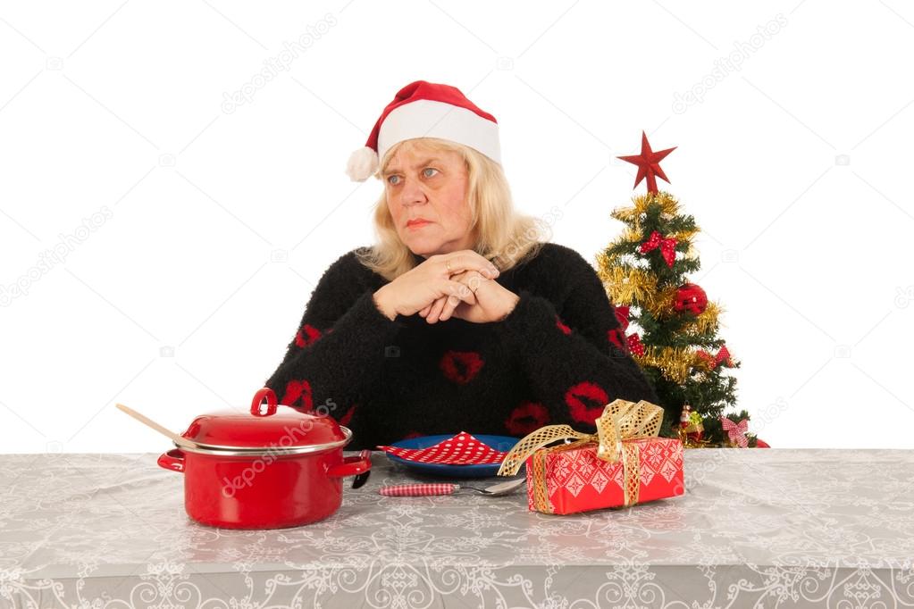 Woman of mature age alone with Christmas