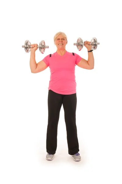 Woman of mature age lifting dumbbels — Stock Photo, Image