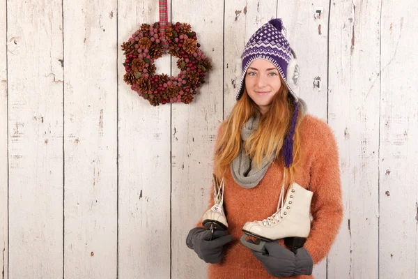 Woman in winter with ice skates — Stock Photo, Image