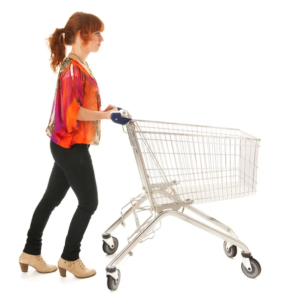 Woman with empty shopping cart — Stock Photo, Image