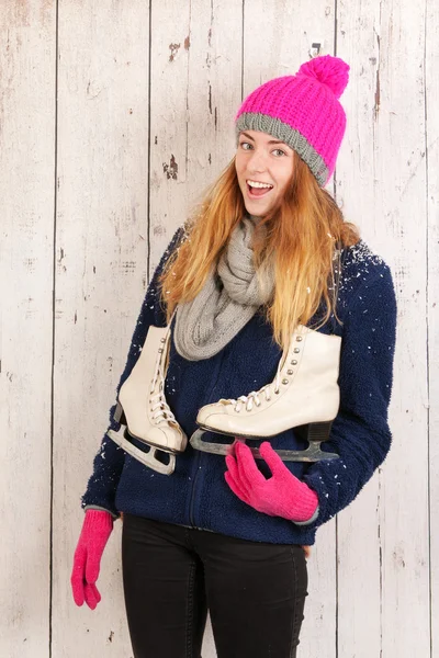 Woman in winter with ice skates — Stock Photo, Image