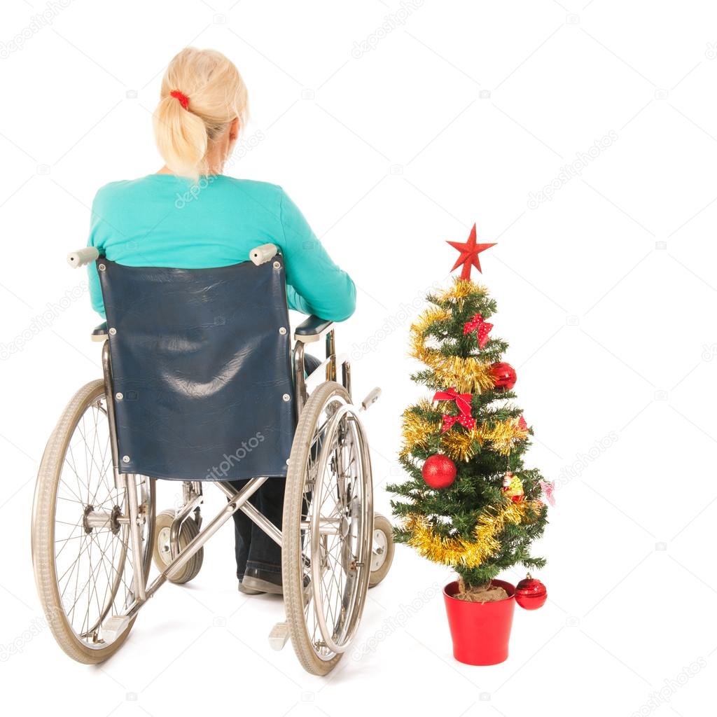 Blond woman in wheel chair while Christmas