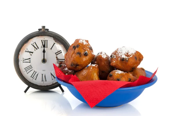 Dutch traditional oliebollen and clock — Stock Photo, Image