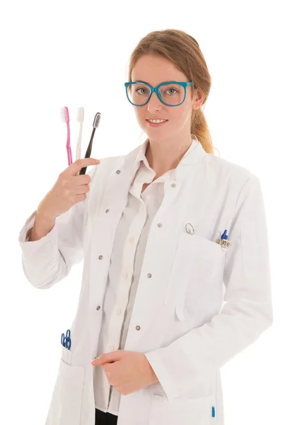 Dentista com escovas mostrando ho para fazer — Fotografia de Stock