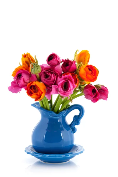 Colorful bouquet butter cups in blue vase — Stock Photo, Image