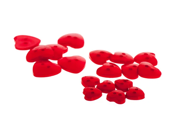 Mehrere Knöpfe in roter Herzform — Stockfoto
