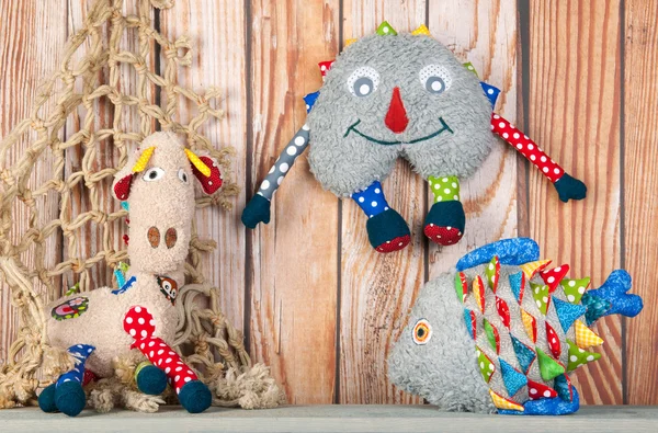Stuffed funny toys on wooden background — Stock Photo, Image